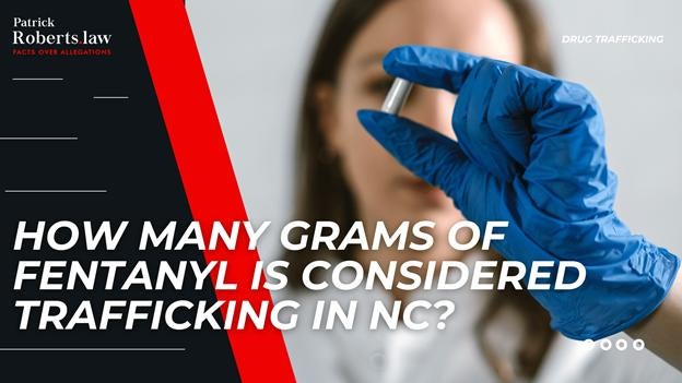 Lawyer-themed banner showing a gloved hand holding a vial of fentanyl with overlay text asking how many grams qualify as trafficking in North Carolina.