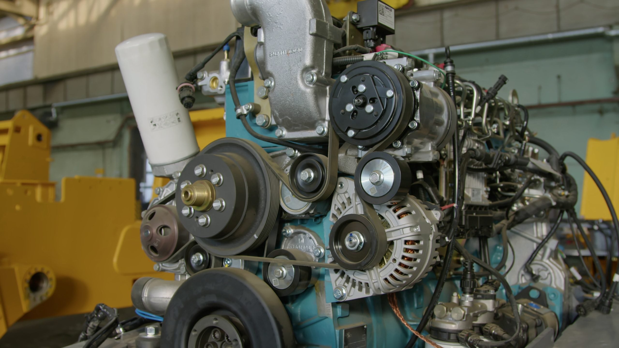 Car engine with exposed car belts