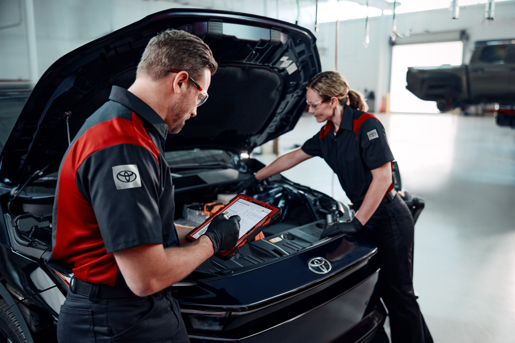 Toyota technicians checking car belts