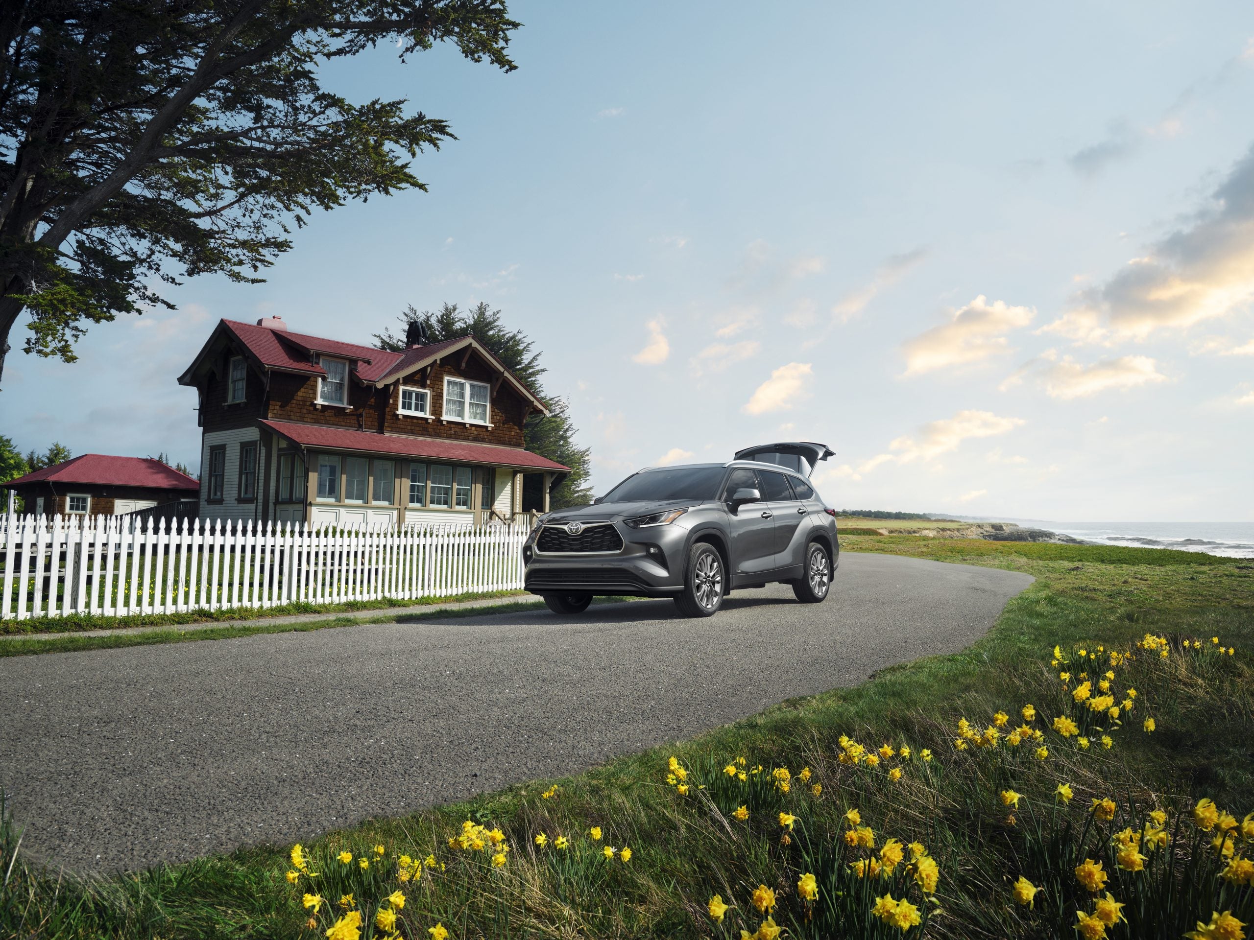 2026 Toyota Highlander in front of a house