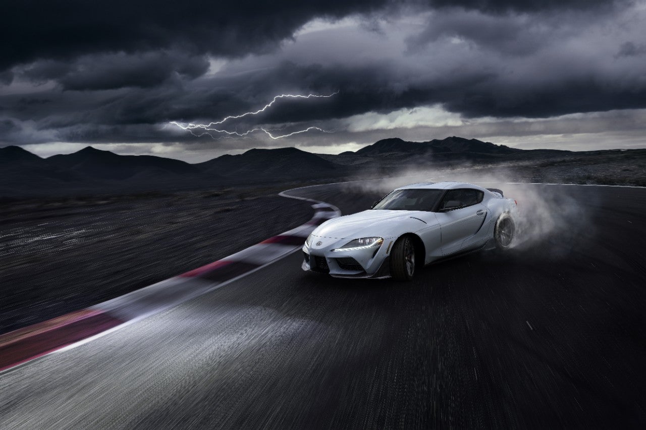 Toyota GR Supra driving on a race track