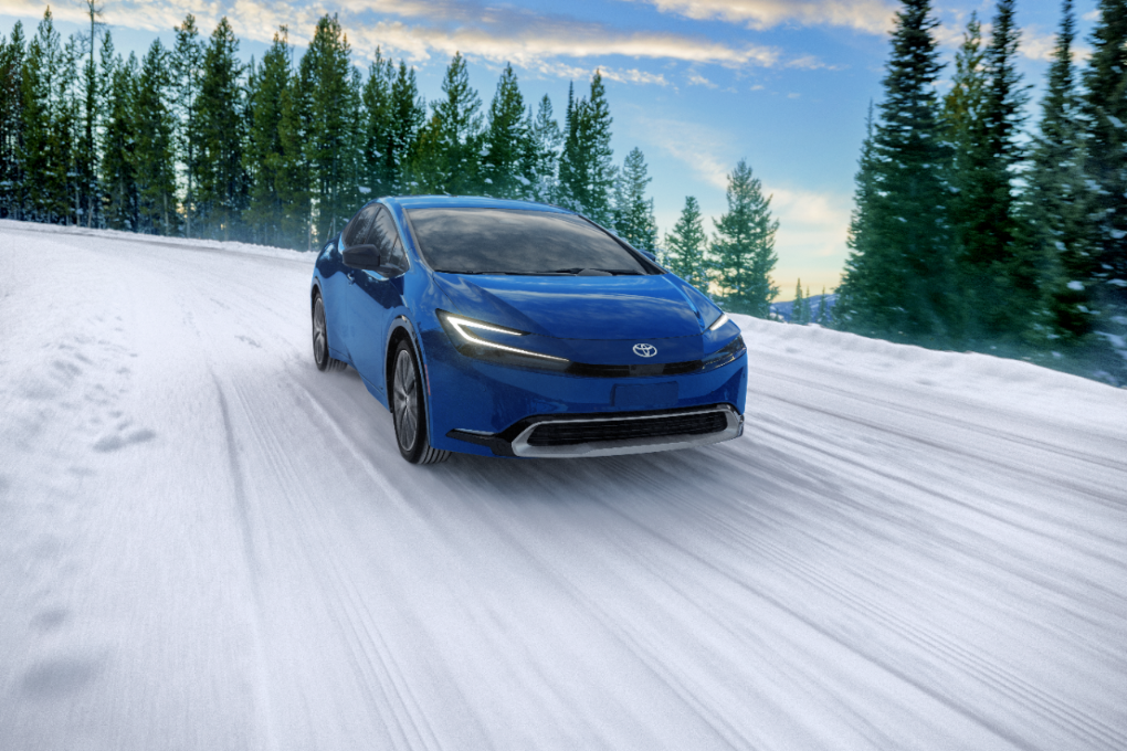 Toyota Prius driving through the snow