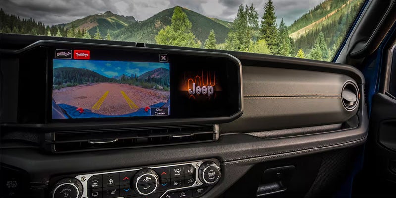 The infotainment system screen of a 2025 Jeep Gladiator displaying the back up camera