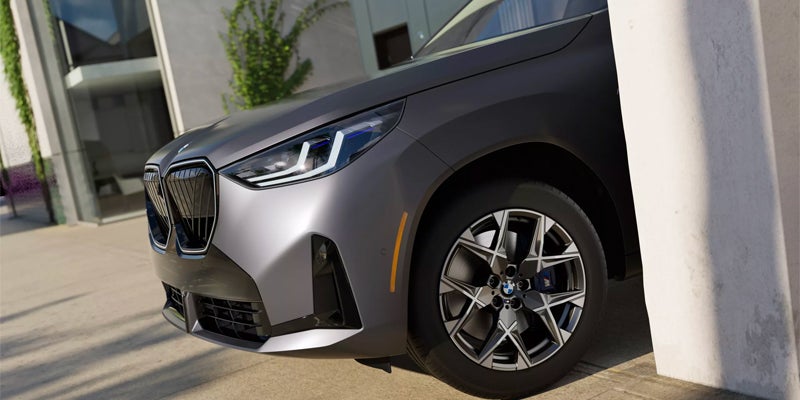 front view of BMW X3 coming out of a garage 