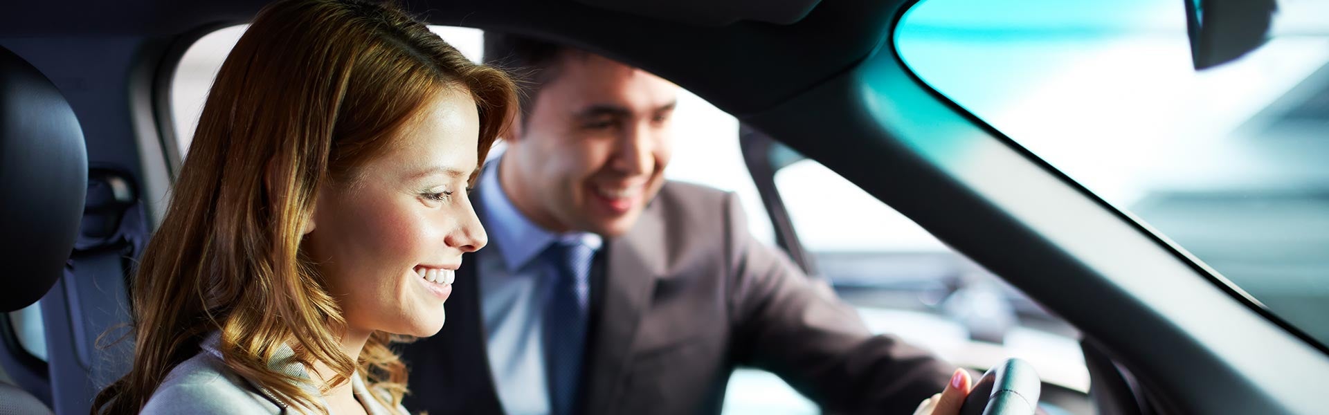 customer and salesman in car