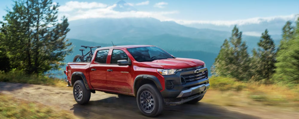Red 2024 Chevrolet Colorado in woods