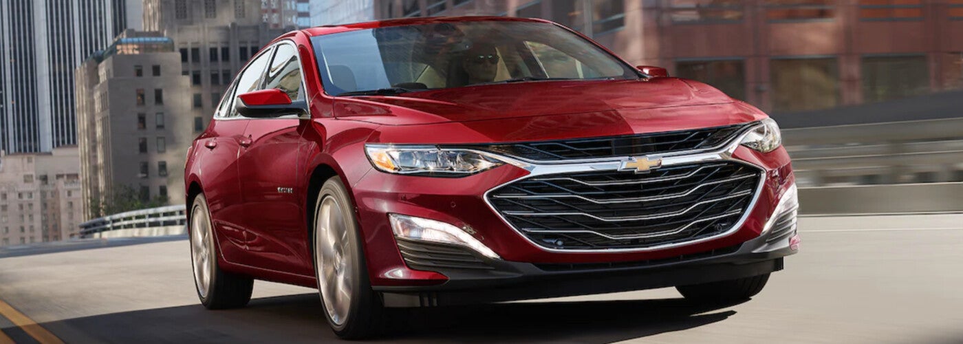 2023 Chevrolet Malibu driving down the road