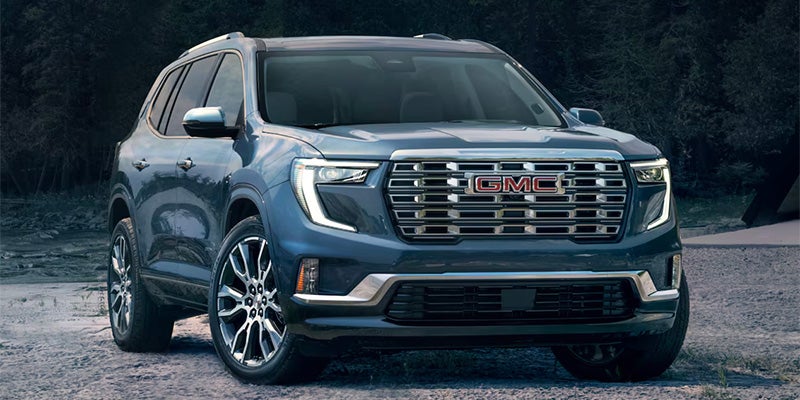 a 2025 GMC Acadia barked on a beach