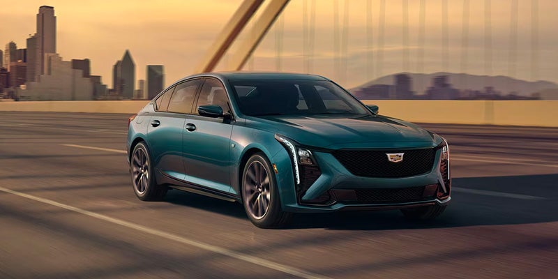 a 2025 Cadillac CT5 driving across a bridge