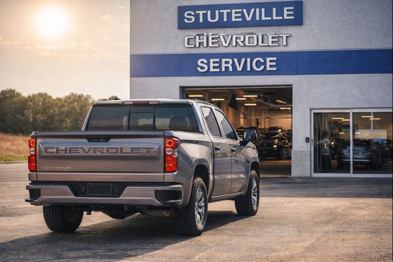 Silver Chevrolet Silverado parked outside the Stuteville Chevrolet service department during routine maintenance in Oklahoma