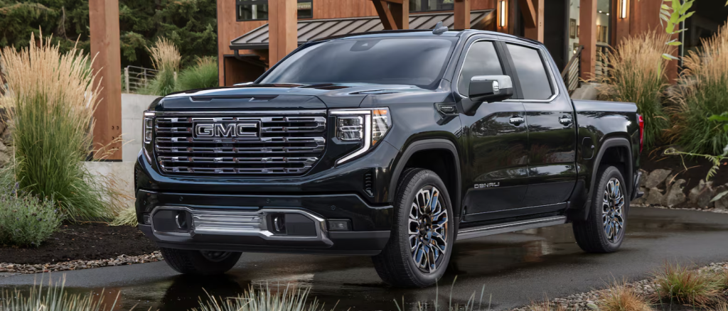 A 2026 GMC Sierra 1500 parked outside a stylish building in Carthage, MS 