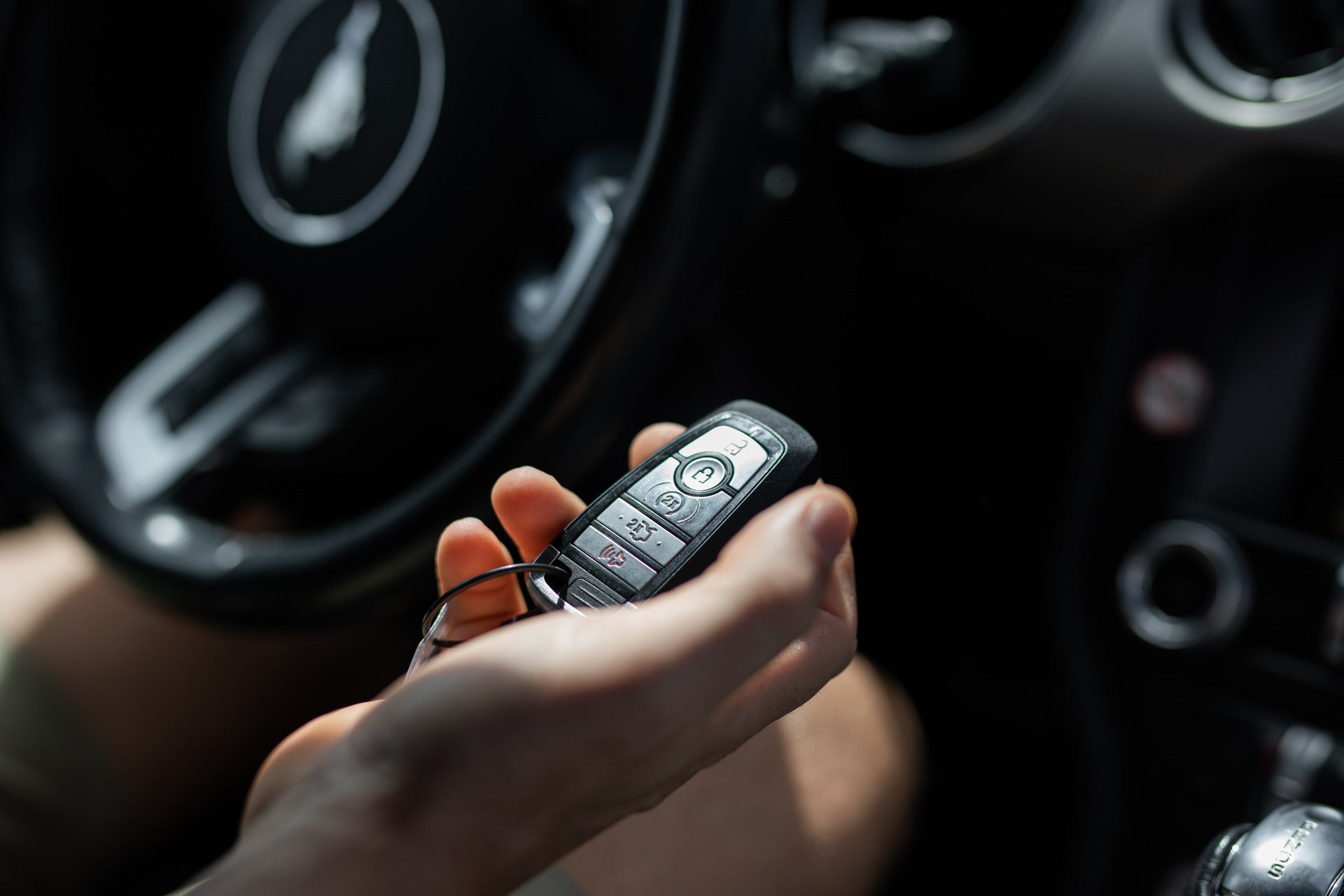 Ford key fob up close in a driver's hand