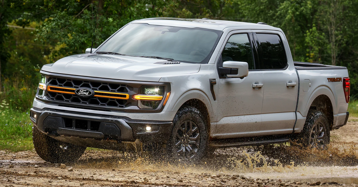 2025 Ford F-150 driving through the mud