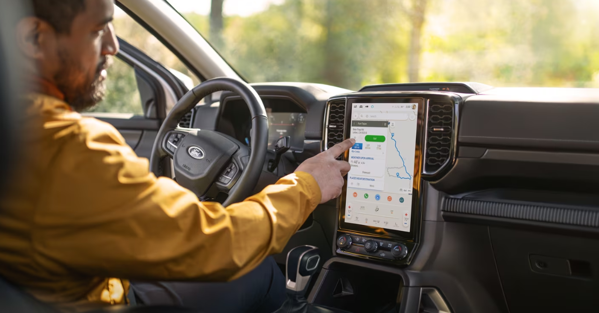Man clicking on the touchscreen of his ford ranger