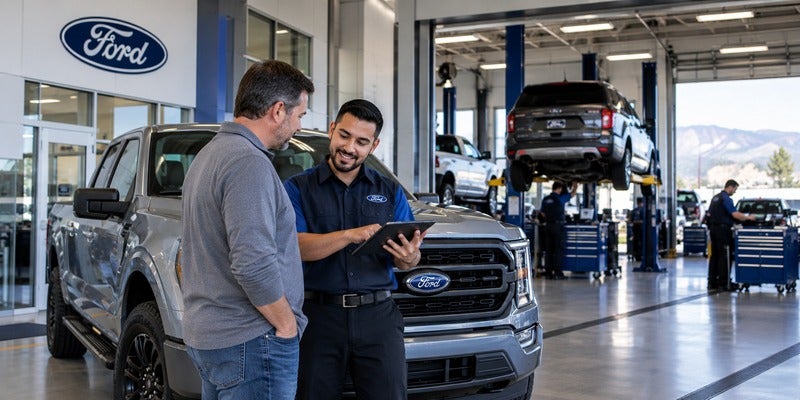 Diamond Ford service advisor reviewing vehicle information with a customer