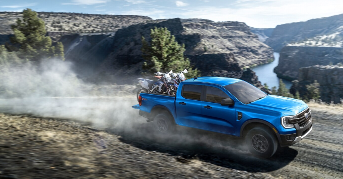 2025 Ford Ranger driving down a gravel road through the mountains