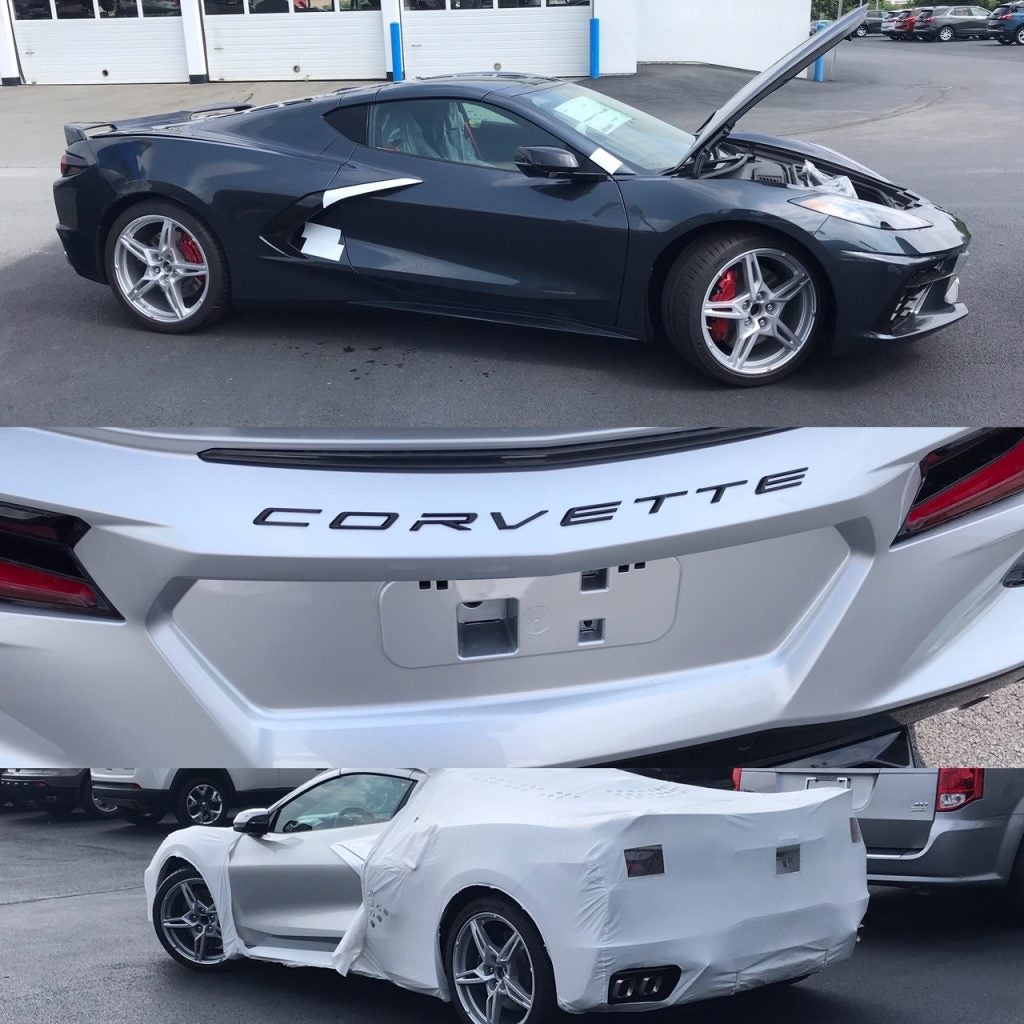 black sports car with its hood up and a white corvette with a sheet over its back half