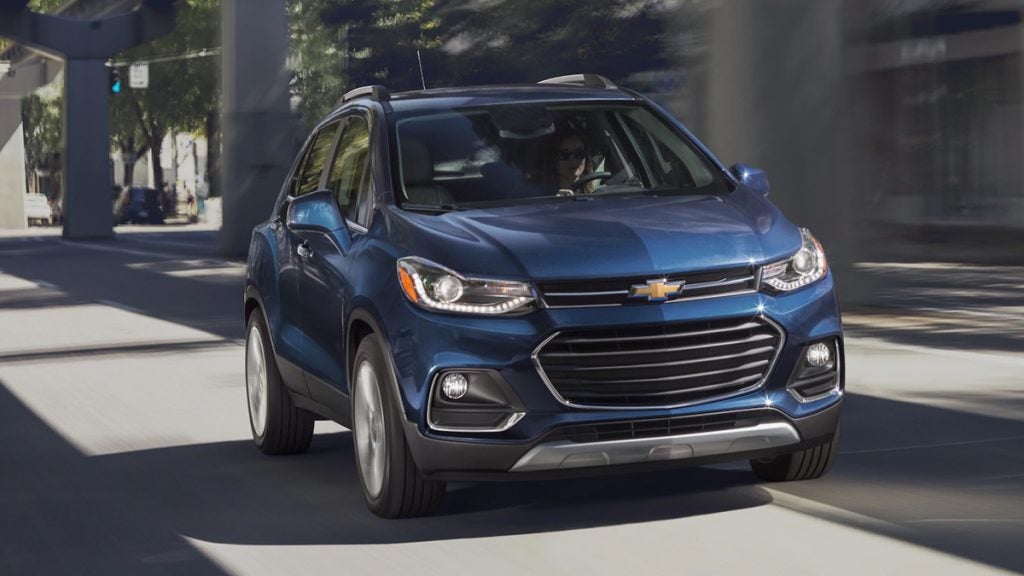woman driving a blue suv