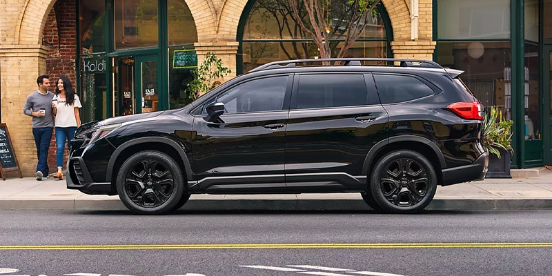 Black Subaru Ascent parked on a city street.