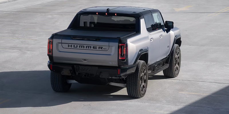 Silver Hummer EV truck on concrete.