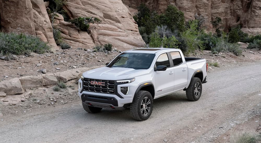A white 2026 GMC Canyon from the front.