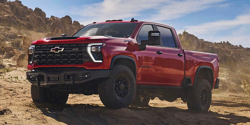 Red Chevrolet Silverado off-road truck
