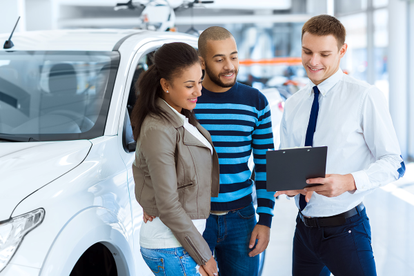 Dealer showing guests financing paperwork
