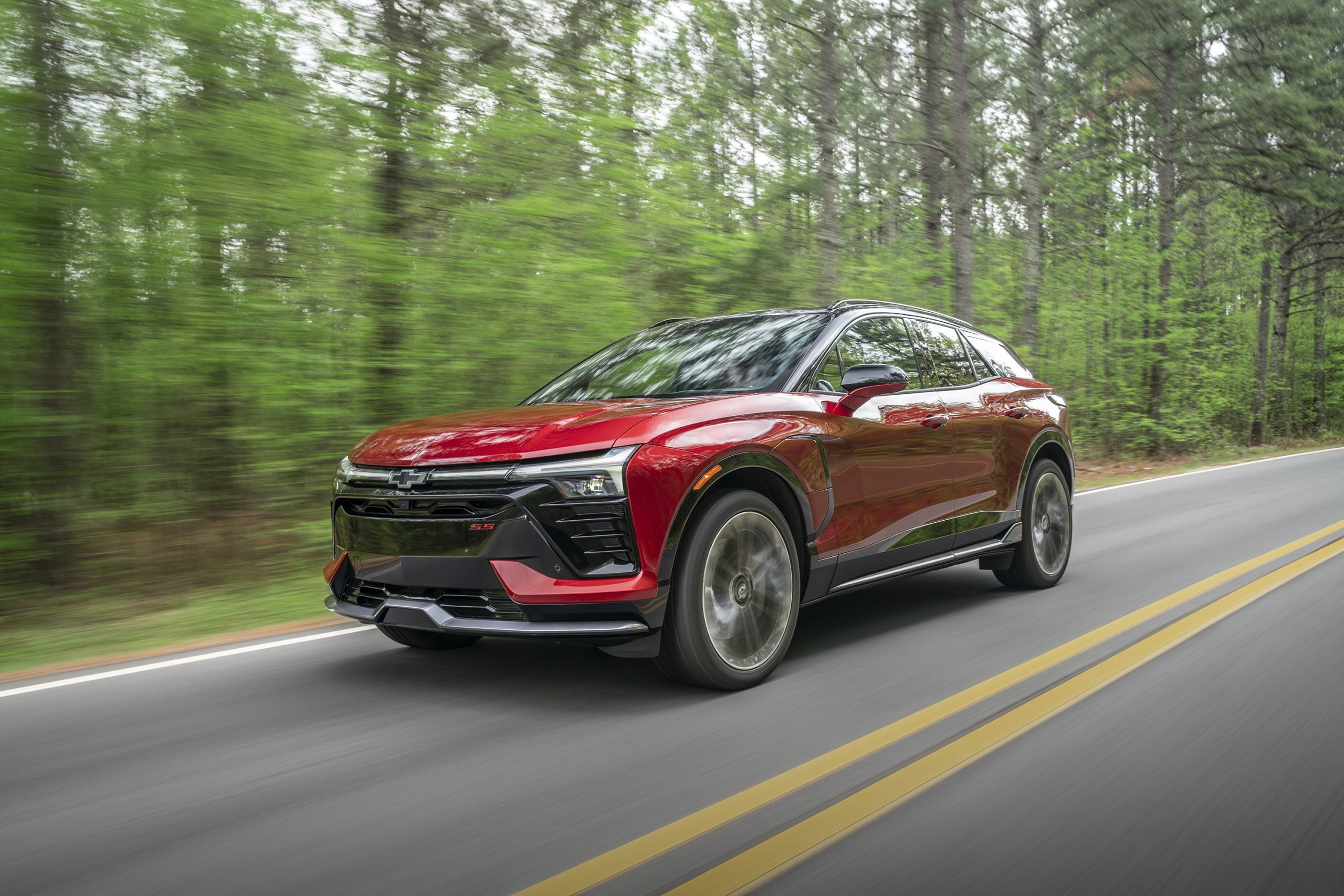 2026 Chevrolet Blazer EV driving through a forest