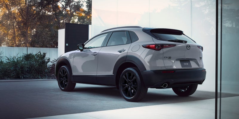 Mazda CX-30 parked outside a building.