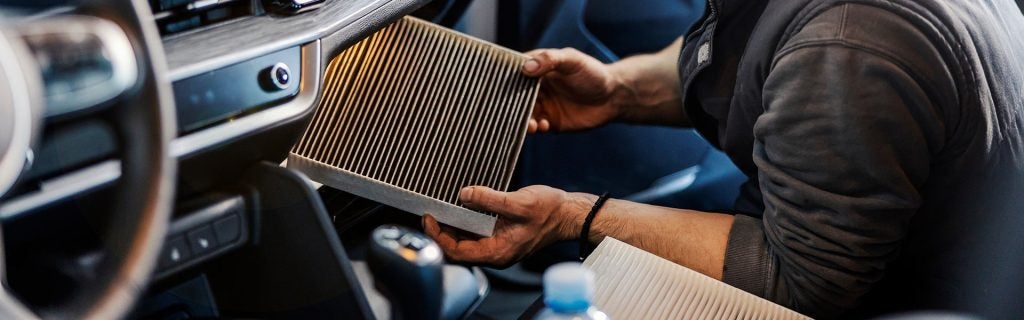 Installing cabin air filter inside car
