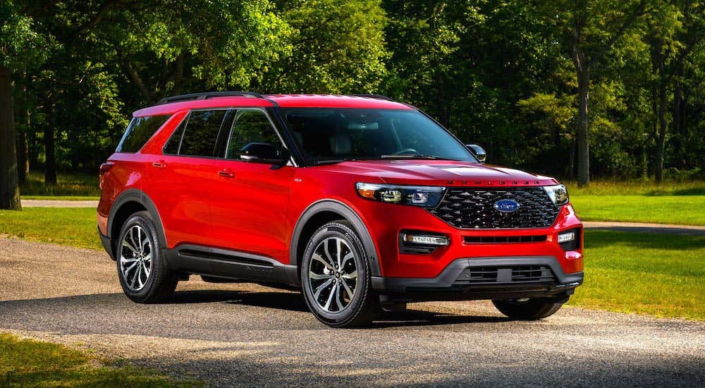 A red 2024 Ford Explorer ST-Line is shown from the front at an angle.