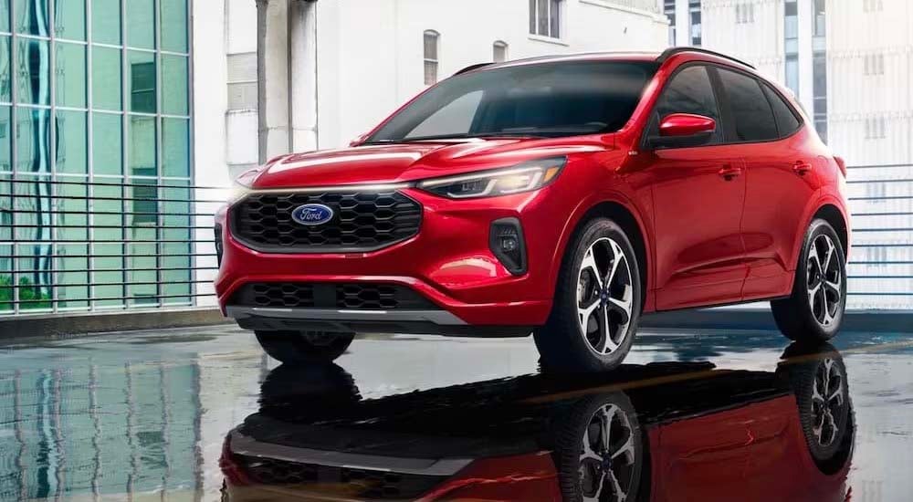 A red 2024 Ford Escape is shown parked near a Boonville Ford dealer.