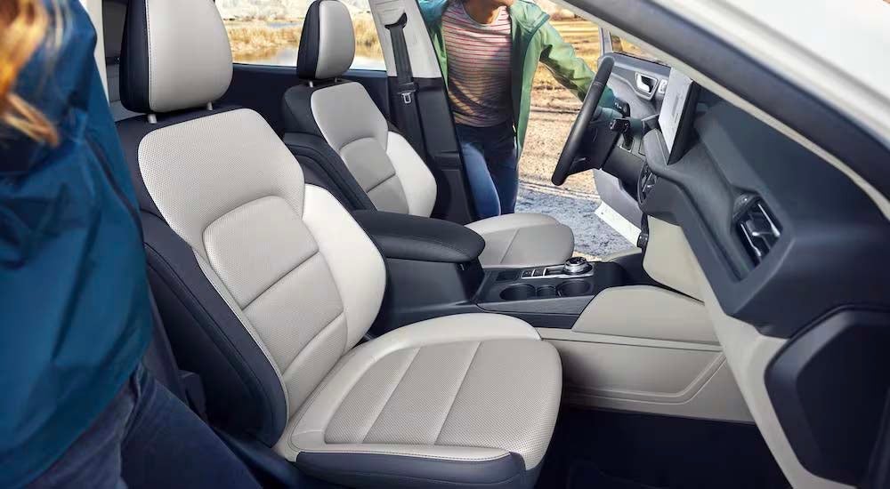 Two people are shown getting into a 2023 Ford Escape for sale near Owensboro, KY.