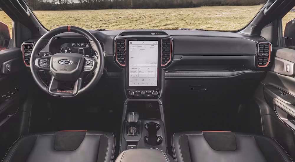The black interior of a 2024 Ford Ranger Raptor is shown from above the center console.