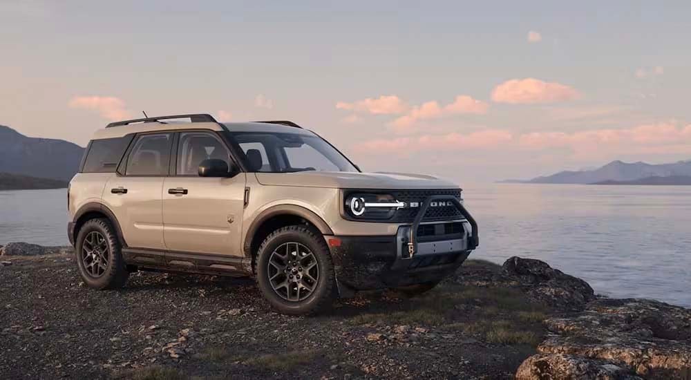 A white 2025 Ford Bronco Sport Big Bend is parked near a lake.