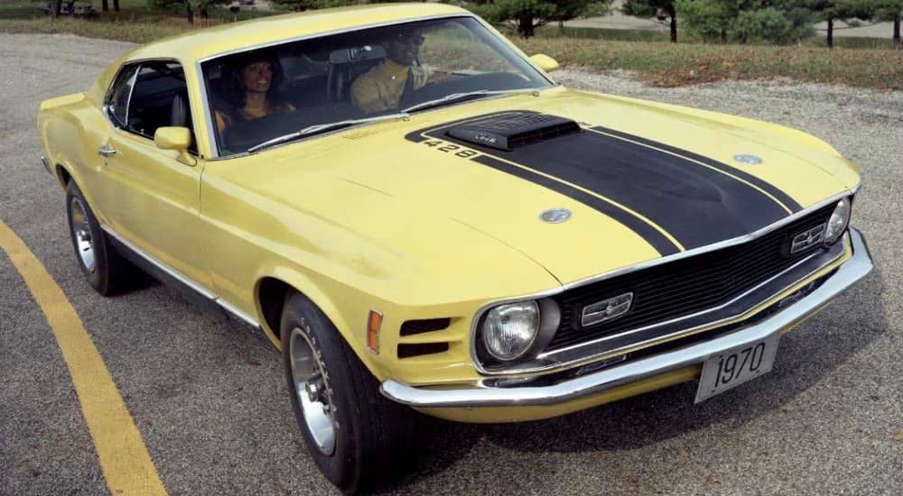A yellow 1970 Ford Mustang Mach I is shown after leaving a used Ford dealer near you.