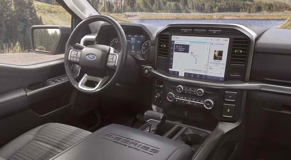 The grey interior and infotainment system is shown in a 2023 Ford F-150 XLT Heritage.