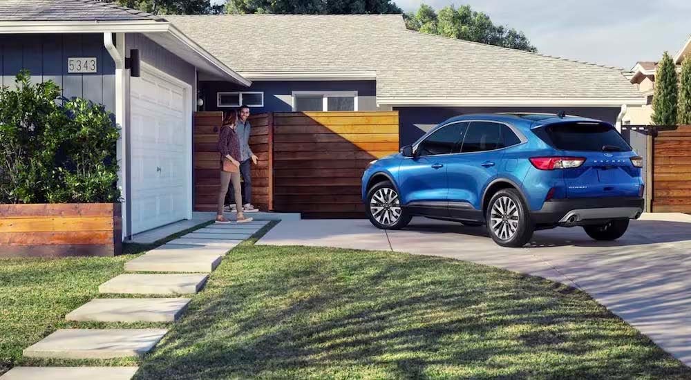 A blue 2022 Ford Escape is shown from the rear at an angle after leaving a used Ford dealer.