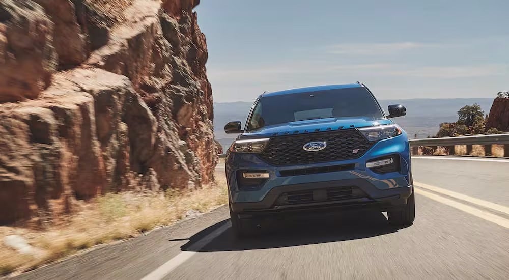 A blue 2021 Ford Explorer ST is shown from the front at an angle after leaving a dealer
