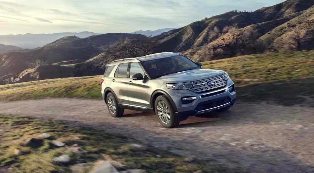 Ford Explorer for Sale - 2023 Ford Explorer - Trail.jpg A silver 2023 Ford Explorer is shown from the front at an angle after leaving a dealer that has a Fo…