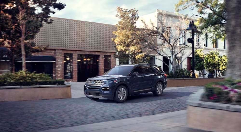 A grey 2023 Ford Explorer Limited Hybrid is shown from the front at an angle.