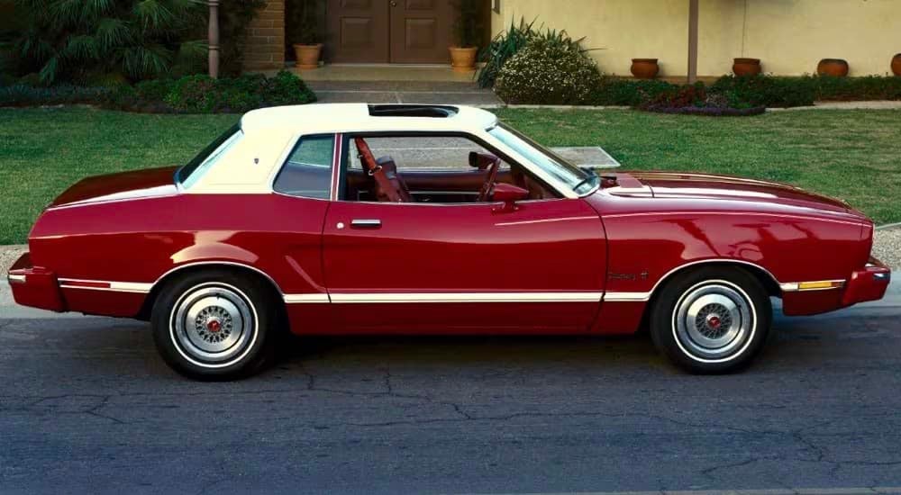 A red 1974 Ford Mustang II Hardtop is shown from the side.