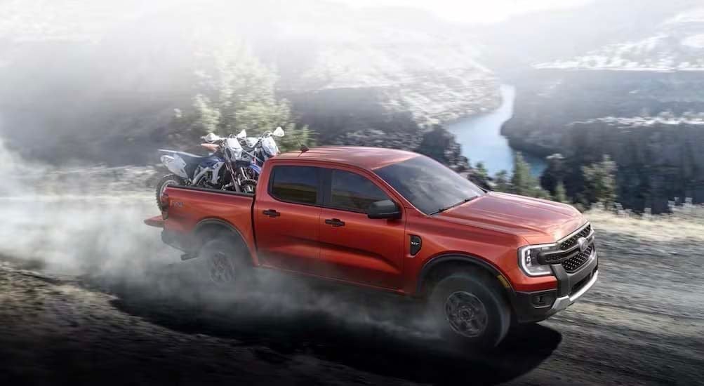 2024%20Ford%20Ranger%20-%20red%20dirt%20bike.jpg A red 2024 Ford Ranger is shown driving to visit a Ford dealer near Robards.