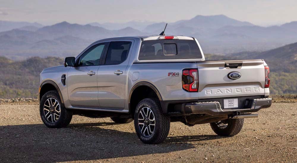 A silver 2024 Ford Ranger FX4 is shown from the rear at an angle.