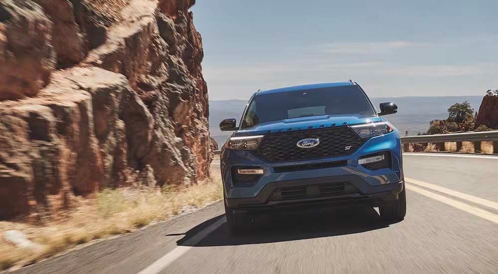 A blue 2024 Ford Explorer ST is shown from the front.