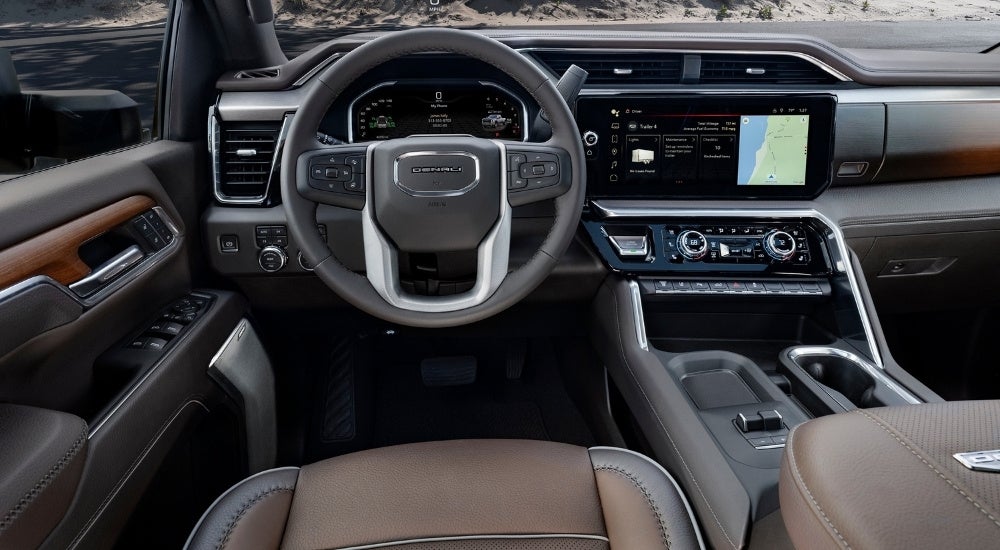 The black and brown interior is shown in a 2024 GMC Sierra 3500 HD Denali.