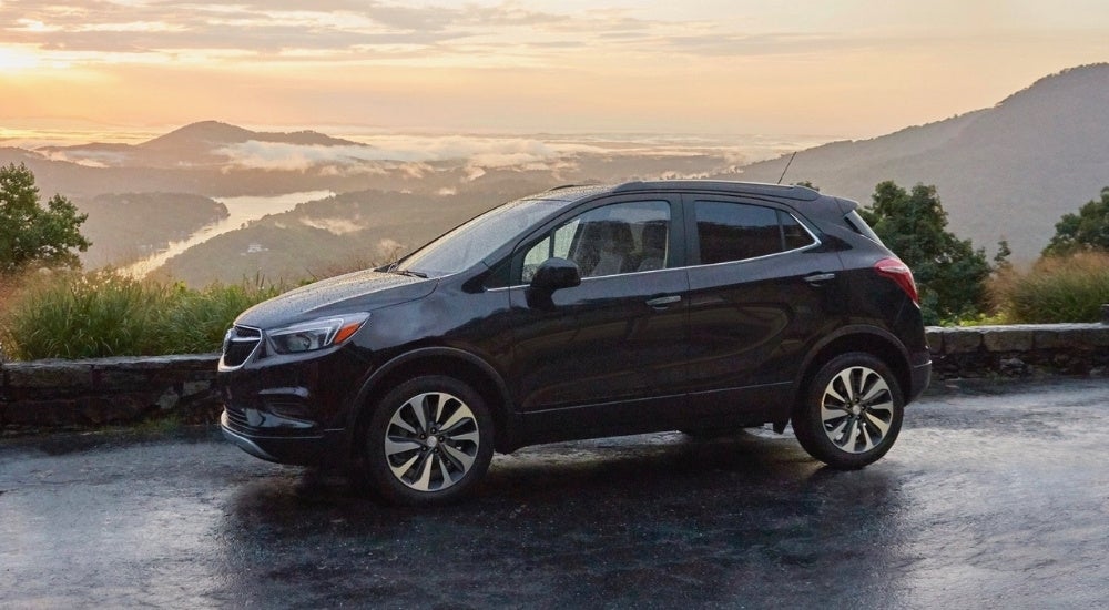 A black 2020 Buick Encore is parked at an overlook.