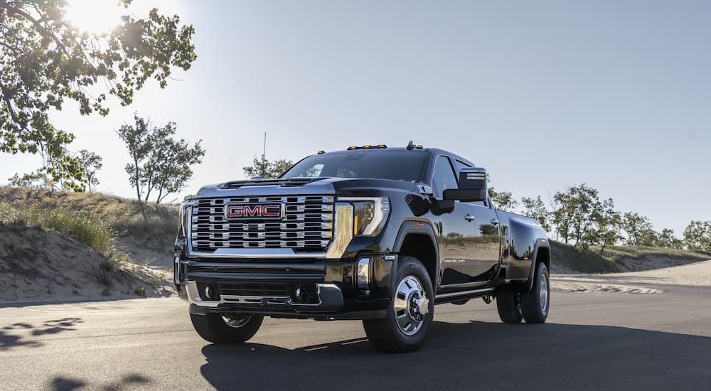A black 2025 GMC Sierra 3500 Denali is shown from the front at an angle.