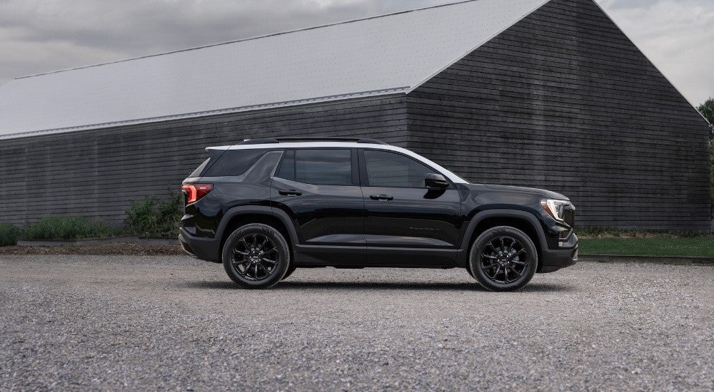 A black 2025 GMC Terrain for sale from the side.