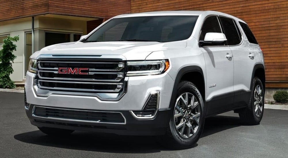 A white 2023 GMC Acadia SLE is shown after visiting a GMC dealer near Rochester, MN.